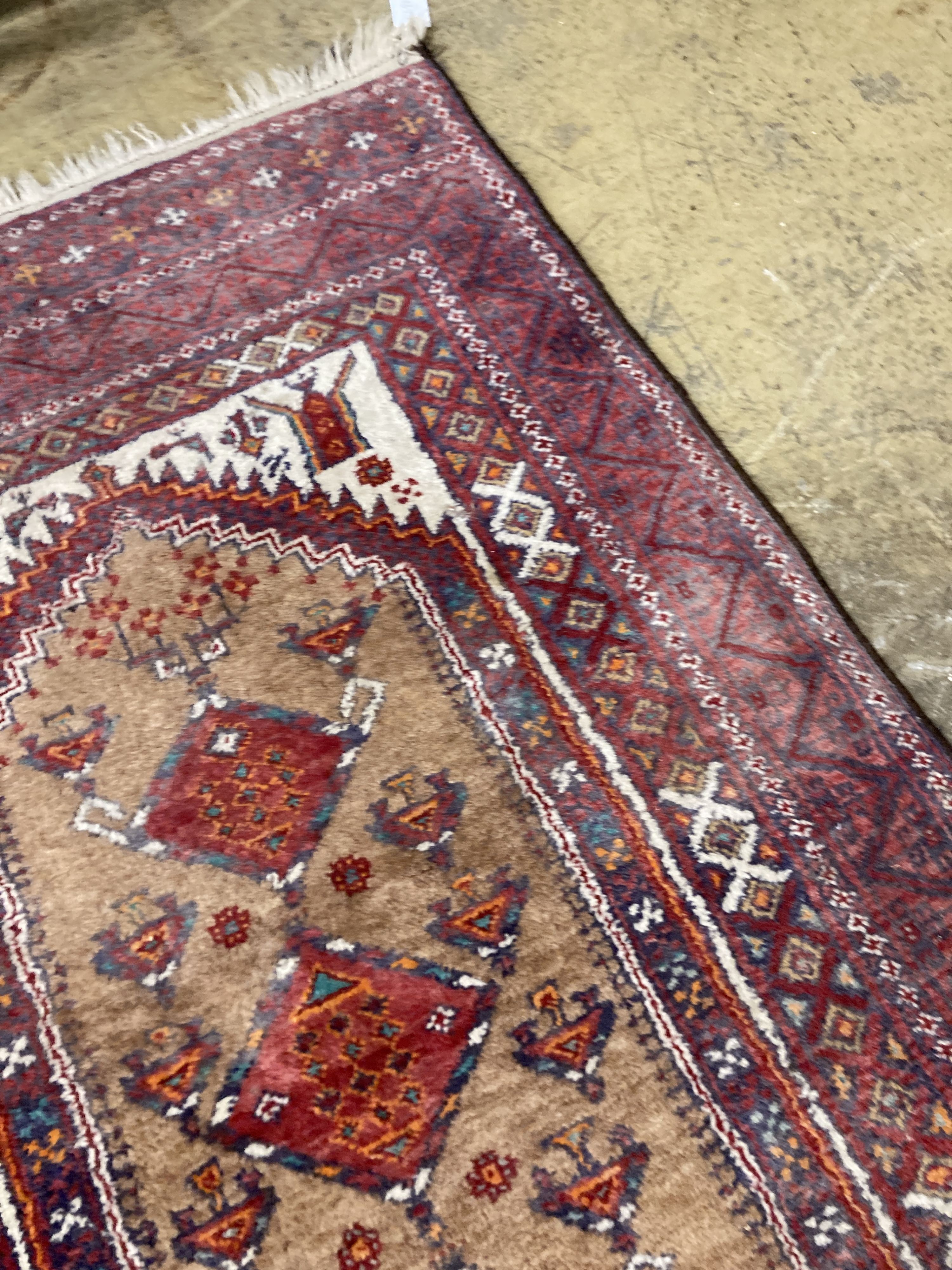 A Caucasian design red ground rug, 206 x 134cm together with a smaller West Persian design rug